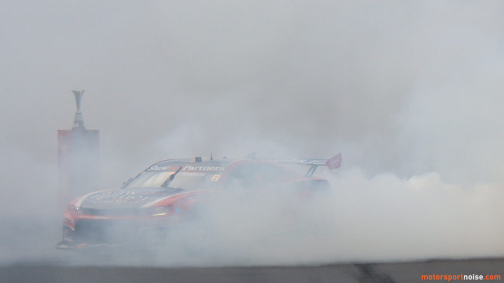 Supercars 2023 champion hiding the trophy in the smoke