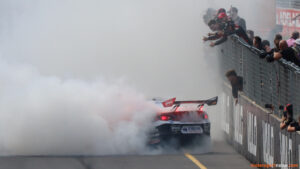 Supercars champion celebrates in front of the team.